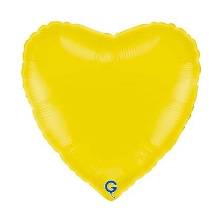 Světle žlutý balonek ve tvaru srdce jako jemná dekorace na jarní nebo dětskou oslavu
